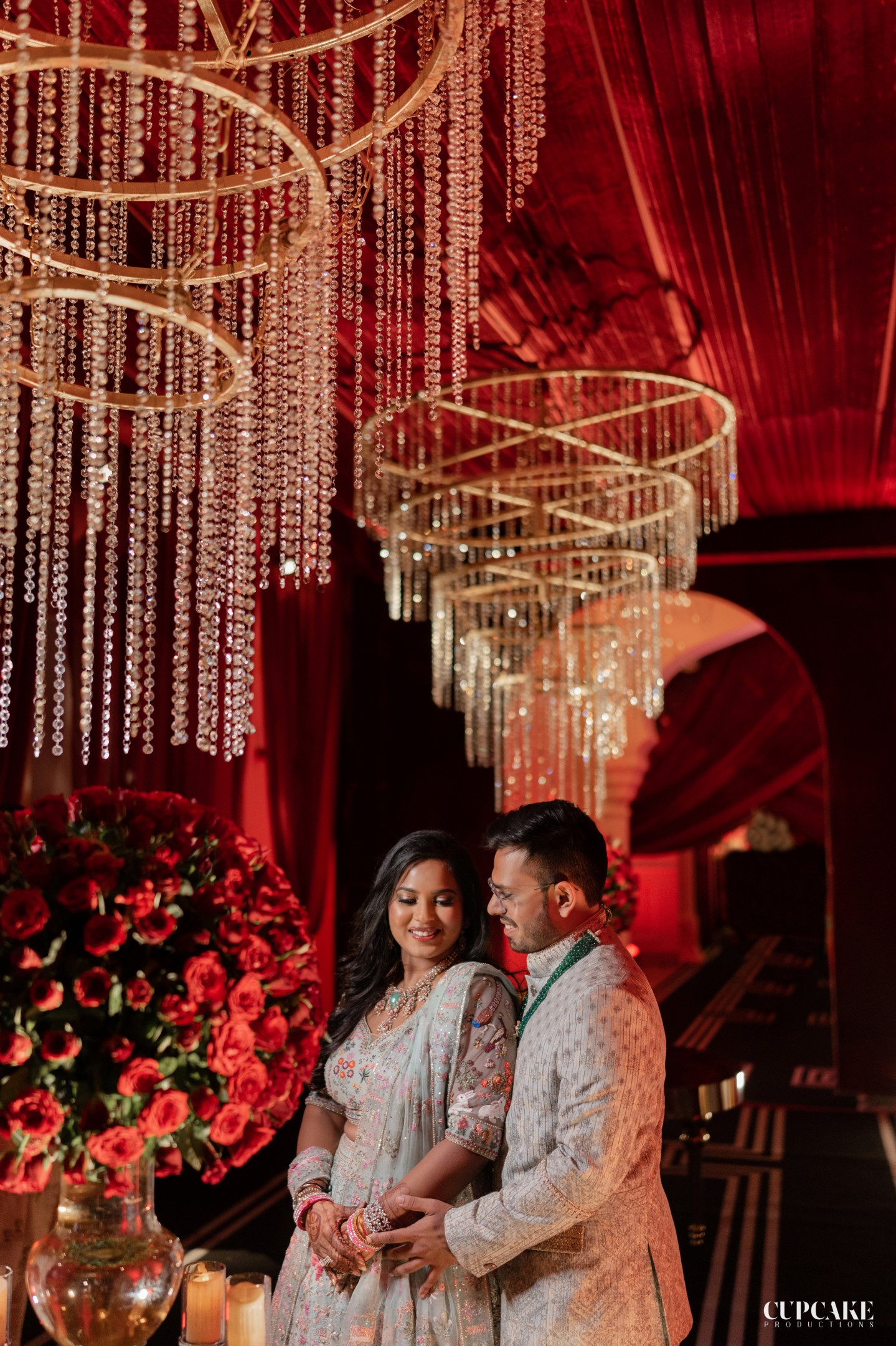 Gilded Chandelier Couple Intimacy
